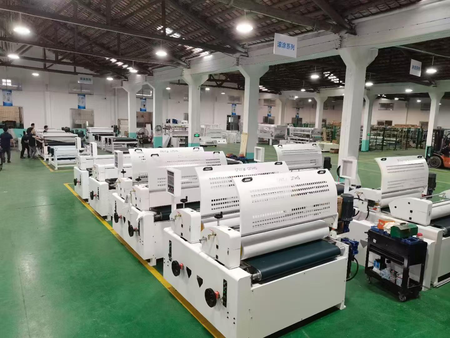 Roller coating machines in workshop